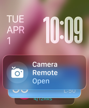 Remote Camera widget appears at bottom of screen, translucent time numerals top right, date top left