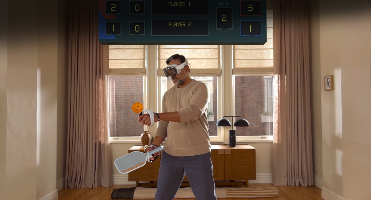 Man wearing Apple Vision Pro and Sony PlayStation VR2 Sense Controller playing: Pickle Pro game, spatial scoreboard above his head