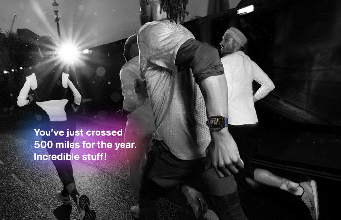 Black-and-white photo of people jogging, text over photo says You've just crossed 500 miles for the year. Incredible stuff!