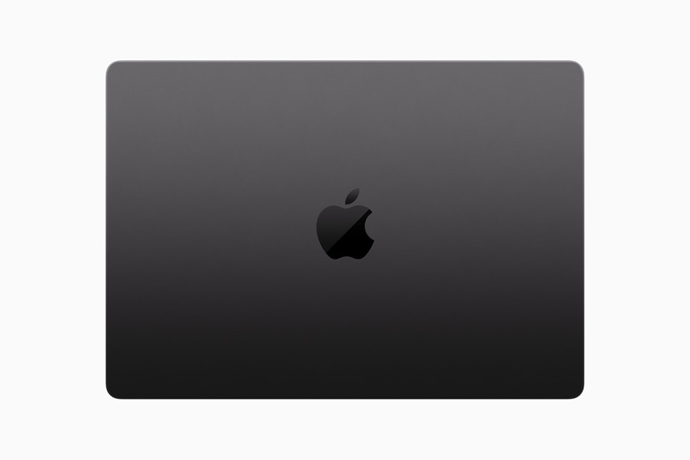 Beyaz bir arka planda yukarıdan gösterilen kapalı bir MacBook Pro.
