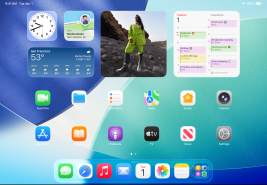 iPad, three models, landscape orientation, with center model in front of two others, Apple Pencil magnetically attached to top of center model, center screen showing the Home Screen featuring colorful app icons with Liquid Glass effect, left screen showing the Preview app, right screen showing Home Screen with files fanning out from the dock